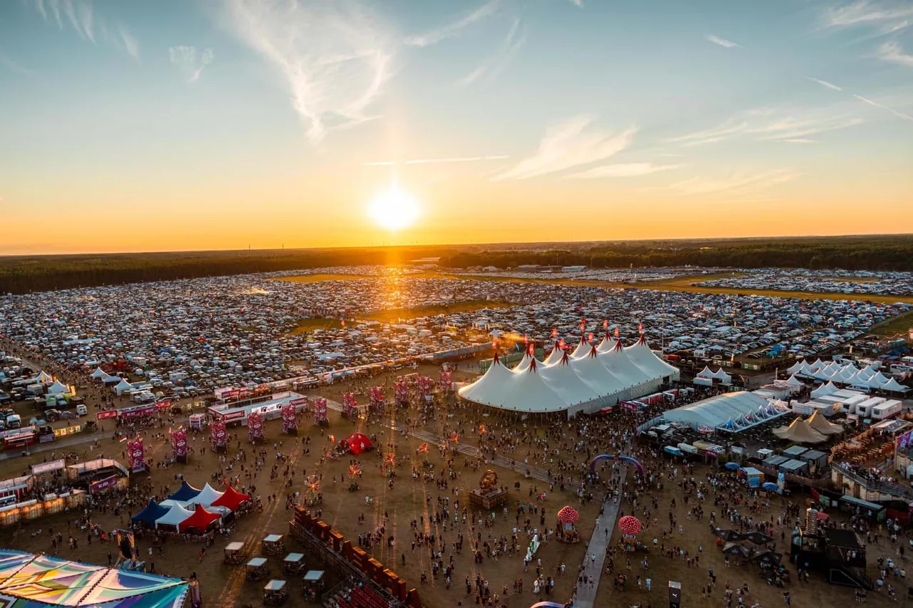 Sunset over the campsites and big tops, seen from above in 2026.