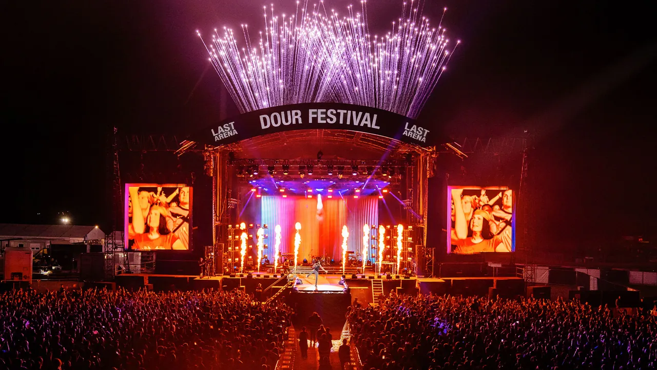 The Last Arena, the main stage, at night under a burst of fireworks.