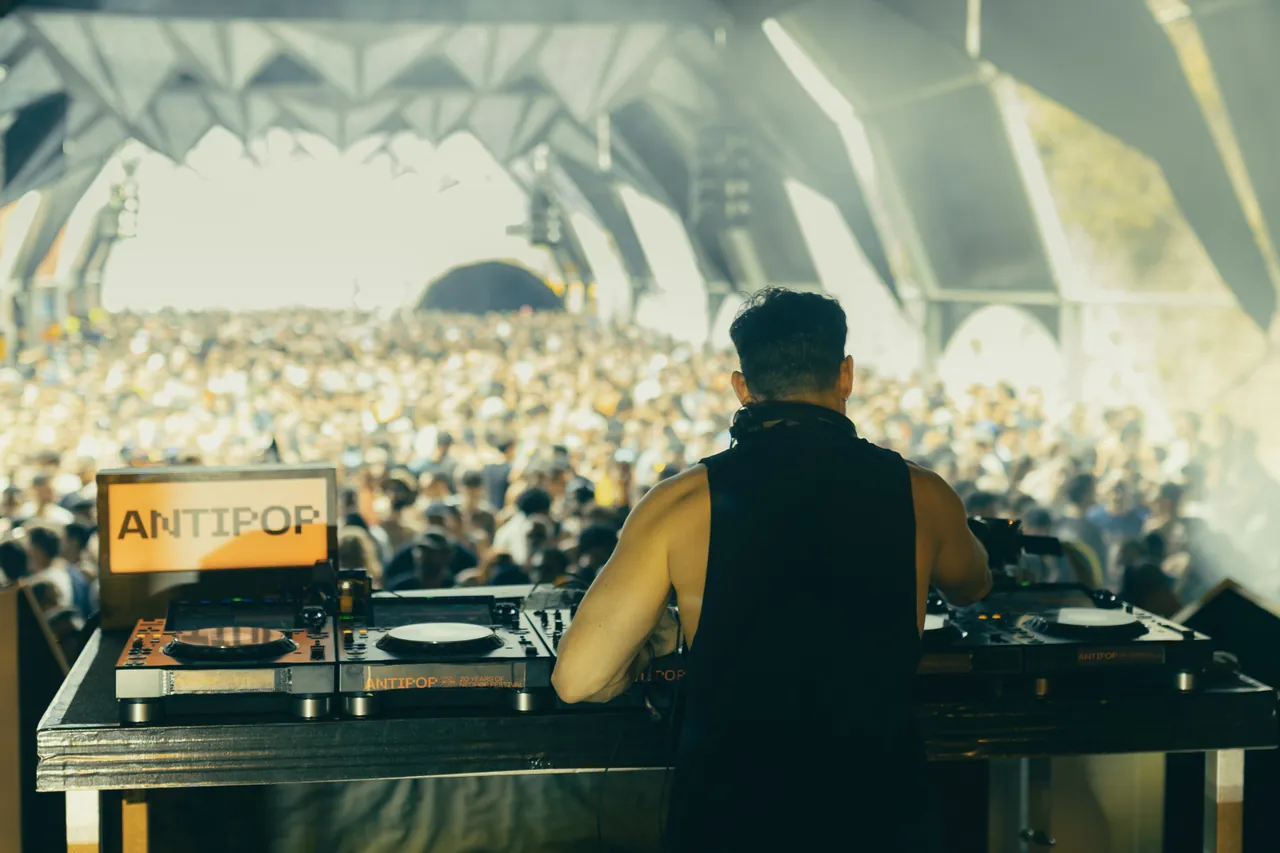 Dax J on the Anti Stage decks in the morning, facing a full tent, Sunday 9 August 2026.