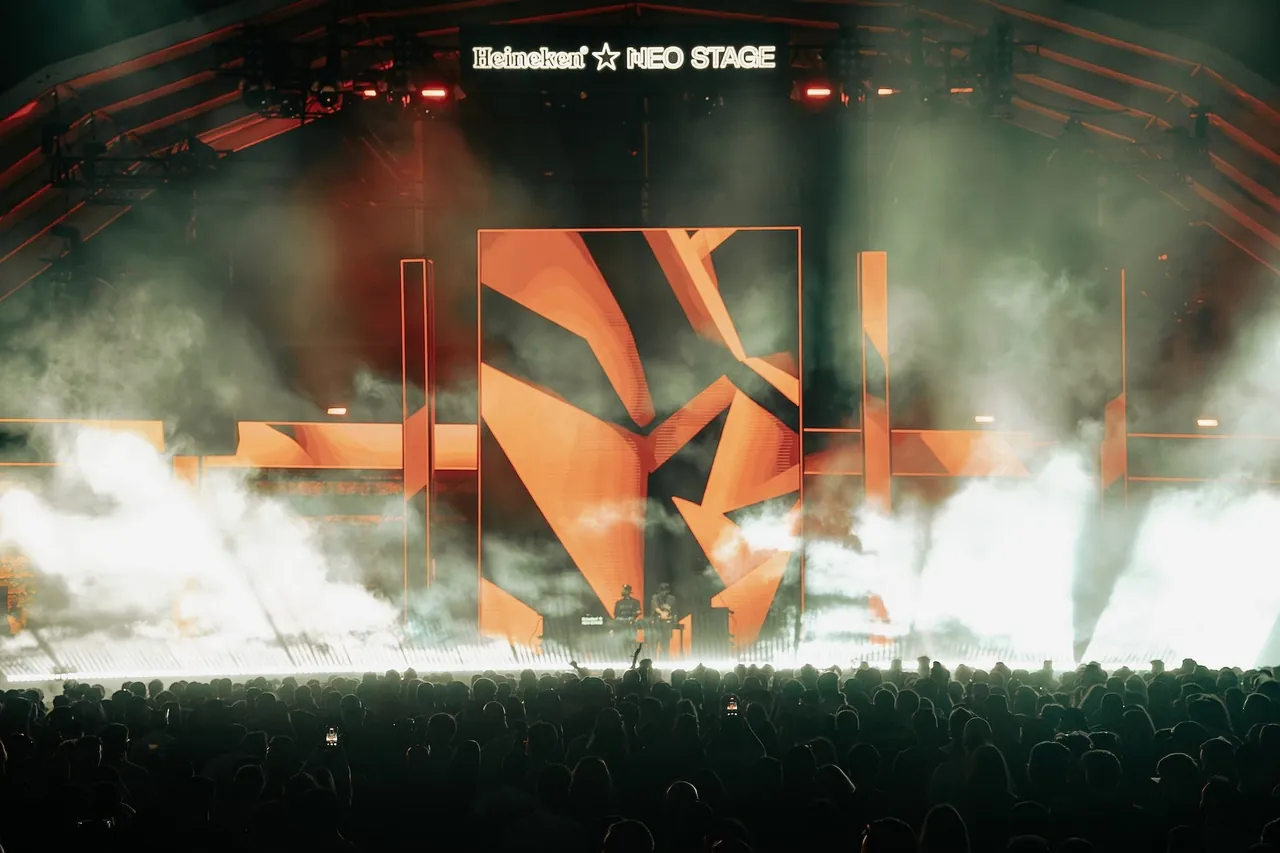 The angular red set of the Neo Stage during The Martinez Brothers' set on Saturday 8 August 2026.