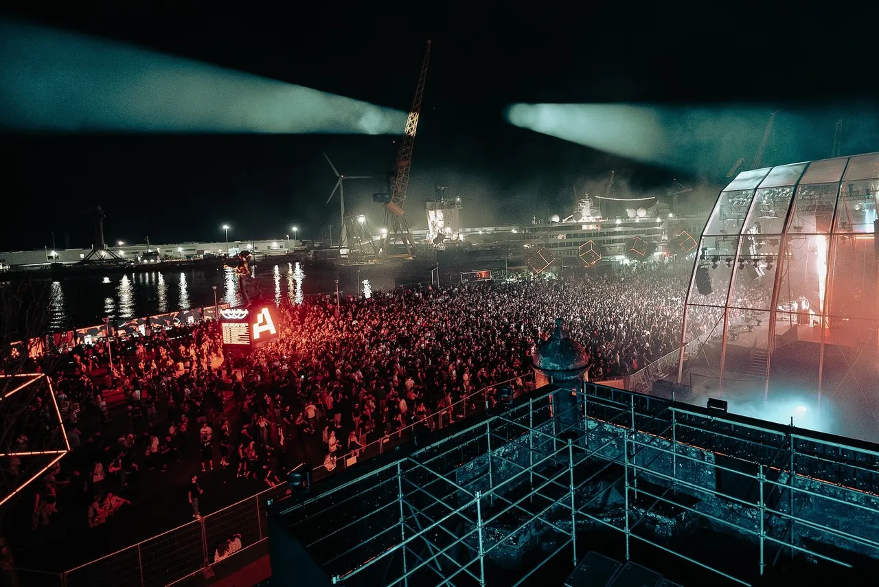 FJAAK x KiNK playing live on the Neo Stage on Saturday 8 August 2026, seen from the fort's rampart facing the harbour.