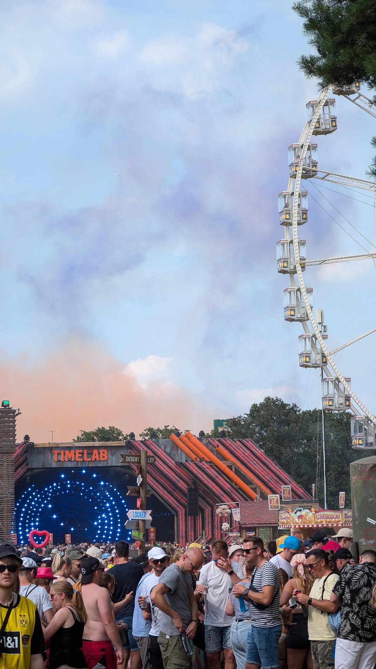 The Time Lab, housed in a former military aircraft shelter, and the Ferris wheel on 19 July 2024.